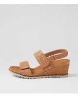 Ziera Kift wedge sandal in coffee-toned raffia with adjustable straps, cushioned footbed, and mid-height wedge sole on a white background