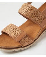 Ziera Kift wedge sandal in coffee-toned raffia with adjustable straps, cushioned footbed, and mid-height wedge sole on a white background