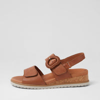 Ziera Vatch wedge sandal in tan leather with adjustable straps, cushioned footbed, and mid-height wedge sole on a white background