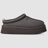 Gray slip-on shoe with a thick sole on a light gray background