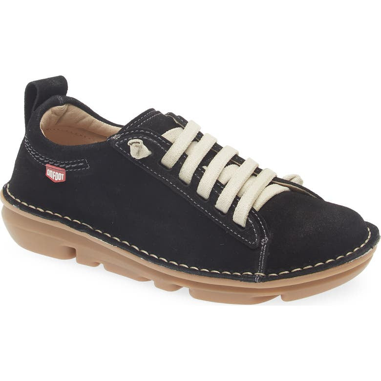 Black casual shoe with white laces on a white background