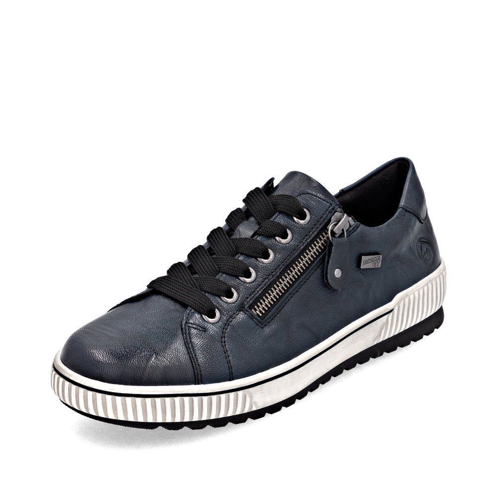 Blue sneaker with a white sole on a white background