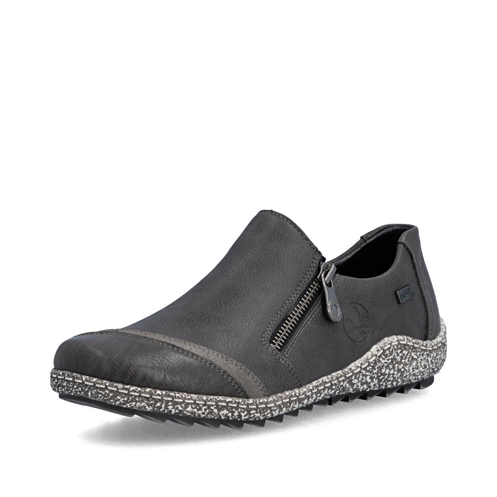 Black leather shoe with brown accents on a white background