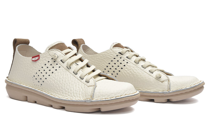 Pair of white sneakers with brown accents on a white background
