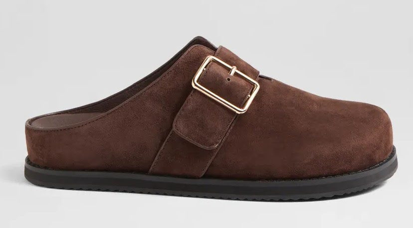 Brown suede slipper with a gold buckle on a light gray background