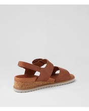 Ziera Vatch wedge sandal in tan leather with adjustable straps, cushioned footbed, and mid-height wedge sole on a white background